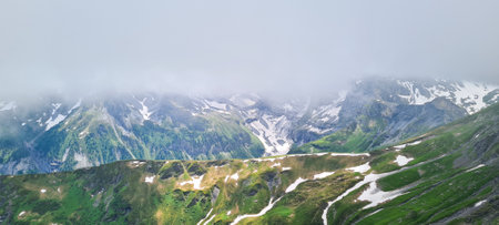 Panoramic view of the mountains in the clouds. Caucasus, Russia