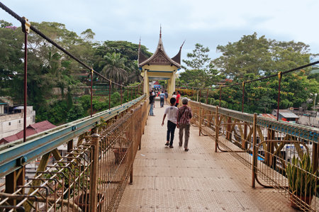 BUKITTINGGI, INDONESIA - DEC 22, 2013: Bridge with Minangkabau architecture. Bukittinggi is the second biggest city in West Sumatra. It is located near the volcanoes Mount Singgalangand, Mount Marapiのeditorial素材