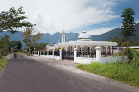 BUKITTINGGI, INDONESIA - DEC 24, 2013: Mosque in the village at Lake Maninjau. Lake Maninjau (Danau...