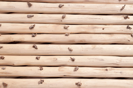 Background of fence made of thin wooden strips and kept together