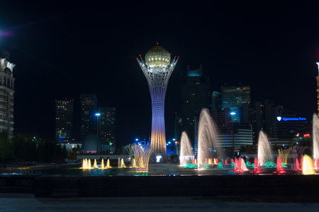 ASTANA, KAZAKHSTAN - MAY 9, 2014: Bayterek Tower and  fountain show at night. Bayterek is a monument and observation tower in Astana. The height of buildings 105 metersのeditorial素材