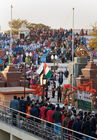 AMRITSAR, INDIA, DEC - 6, 2014: The India-Pakistan Wagah Border Closing Ceremony. It happens at the border gate, two hours before sunset each day. The flag ceremony is conducted by Indian Border Security Force and Pakistan Rangers.のeditorial素材