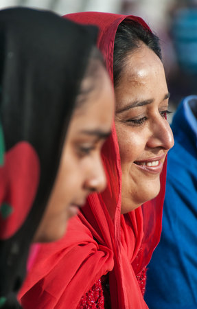AMRITSAR, INDIA, DEC - 7, 2014: Unidentified woman  in Golden Temple (Harmandir Sahib also Darbar Sahib). Golden Temple is the holiest Sikh gurdwara located in the city of Amritsar, Punjab, India.のeditorial素材