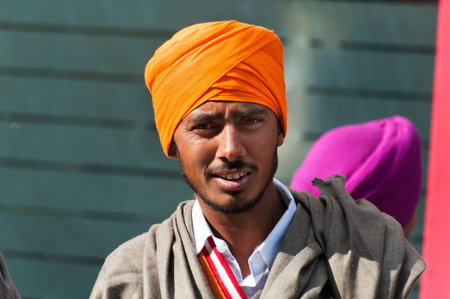AMRITSAR, INDIA, DEC - 7, 2014: Unidentified Indian Young Sikh man on the street in Amritsar, Punjab.  It is home to the Harmandir Sahib (Golden Temple), the spiritual and cultural center for the Sikh religion.のeditorial素材