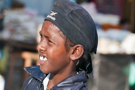 AMRITSAR, INDIA, DEC - 7, 2014: Unidentified Indian Young boy on the street in Amritsar, Punjab.  It is home to the Harmandir Sahib (Golden Temple), the spiritual and cultural center for the Sikh religion.のeditorial素材