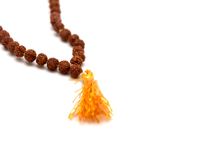 Japa mala. Prayer beads made from the seeds of the rudraksha tree. Isolated on white backgroundの写真素材