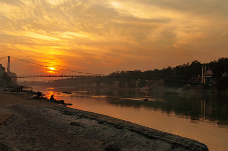 View of River Ganga and Ram Jhula bridge at sunset. Rishikesh. Indiaの写真素材