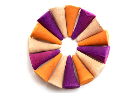 Colorful incense cones isolated on white backgroundの写真素材