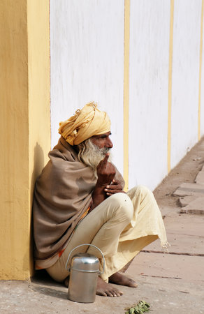 VRINDAVAN, INDIA - DEC 15, 2014:  Indian sadhu sits on the street. Vrindavan is considered to be a holy place. The major tradition followed in the area is Vaisnavism. It is the place where Krishna spent his childhood days.のeditorial素材