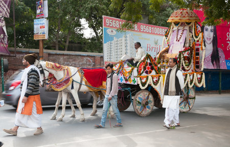 VRINDAVAN, INDIA - DEC 15, 2014: Ritual procession on the street. Vrindavan is considered to be a holy place. The major tradition followed in the area is Vaisnavism. It is the place where Krishna spent his childhood days.のeditorial素材