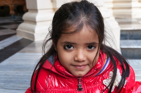 VRINDAVAN, INDIA - DEC 15, 2014:  Unidentified Indian girl in Sri Krishna-Balaram Temple. Vrindavan is considered to be a holy place. The major tradition followed in the area is Vaisnavism. It is the place where Krishna spent his childhood days.のeditorial素材