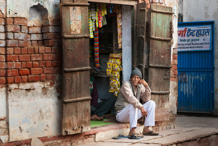VRINDAVAN, INDIA - DEC 15, 2014:  Unidentified Indian market vendor in local street shop. Vrindavan is considered to be a holy place. The major tradition followed in the area is Vaisnavism. It is the place where Krishna spent his childhood days.のeditorial素材