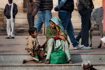 ORCHHA, INDIA - DEC 19, 2015: Unidentified Indian mother and son talking on the street at the temple. Orchha is a town in Madhya Pradesh state? The town was established by Maharaja Rudra Pratap Singh in 1501のeditorial素材
