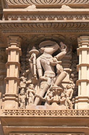 Stone carved erotic sculptures of Deity on temple. Western temples of Khajuraho. Madhya Pradesh. India. Built around 950-1050の写真素材