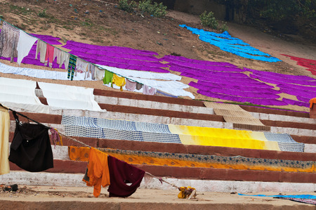 Laundry drying on the steps of ghat near Ganga river.  Varanasi. Uttar Pradesh. Indiaの写真素材