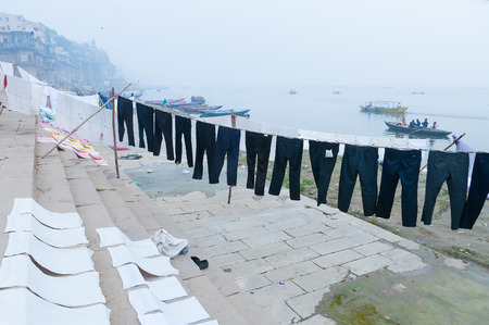 Laundry drying on the steps of ghat near Ganga river.  Varanasi. Uttar Pradesh. Indiaの写真素材
