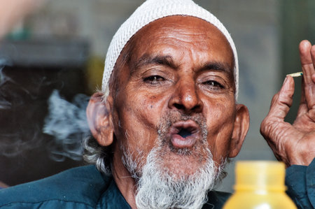 BANGALORE, INDIA - DEC 25, 2014:  Unidentified Indian elderly man on Russell Market. Russell Market is a shopping market in Bangalore, built in 1927 by the British.のeditorial素材