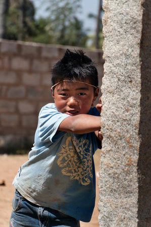 BANGALORE, INDIA - DEC 26, 2014: Portrait of unidentified Indian boy on the street in Bangaloreのeditorial素材
