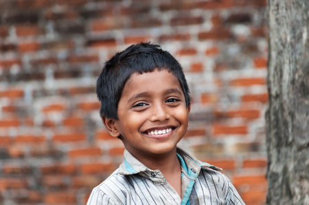 KOVALAM, INDIA - DEC 28, 2014: Portrait of unidentified Indian boy on the street in fishing village. Kovalam. Kerala. Indiaのeditorial素材