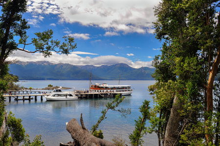 San Carlos De Bariloche , Argentina - Jan 21, 2011: Tourists boats at the pier in Lake Nahuel Huapi. Los Arrayanes National Park.のeditorial素材