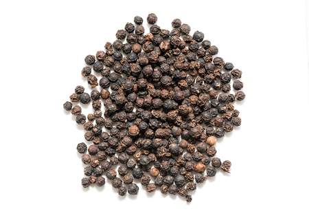 Pile of black pepper isolated on white background selective focus