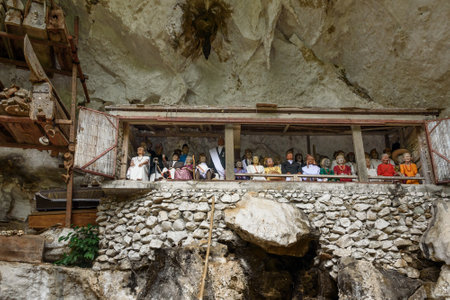 Tana Toraja, Indonesia - Dec 08, 2015: Galleries of tau-tau on balcony guard the graves. Londa is cliffs and cave old burial site in Tana Toraja. Inside there's a collection of coffins. South Sulawesiのeditorial素材