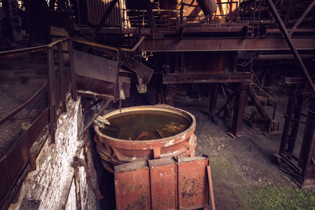 Old slag disposal pots, mounted on railway platforms in blast furnace workshop on Mining and metallurgical plantのeditorial素材