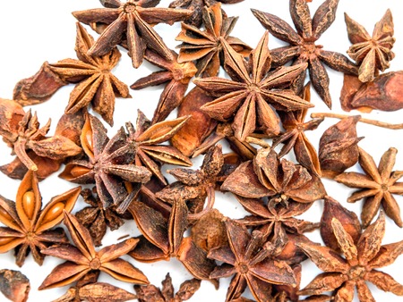 Top view of Anise stars on white background. Texture