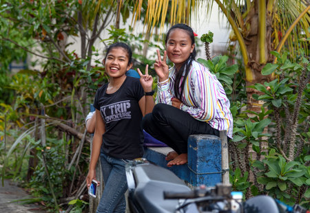 Tangkoko, Indonesia- Dec 25, 2015: Unidentified Indonesian girlse on the street in Batu Putih villageのeditorial素材