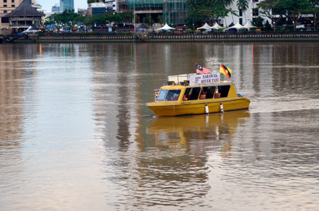 Kuching, Malaysia - Dec 30, 2015: Sarawak river taxi boat on the river in Kuching city. Sarawak. Borneo.のeditorial素材