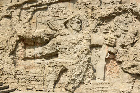 Volgograd, Russia - August 31, 2016: Fragment of bas-relief of Ruined walls. It is walls present ruins of Stalingrad that was demolished but undefeated. Memorial complex Mamayev Kurgan in Volgograd.のeditorial素材