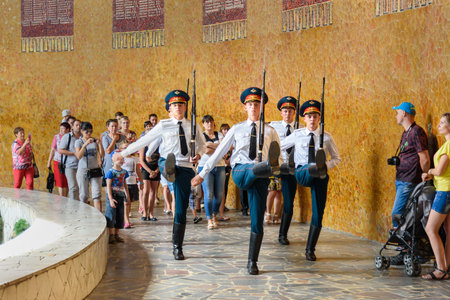 Volgograd, Russia - Aug 31, 2016: Soldiers guard march in Hall of Military Glory. In centre of hall is sculpture of hand holding torch with Eternal Fire. Memorial complex Mamayev Kurganのeditorial素材