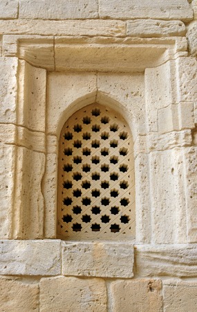 Brick Wall with window in Old city, Icheri Sheher is the historical core of Baku. Azerbaijan. World Heritage Site by UNESCOの写真素材