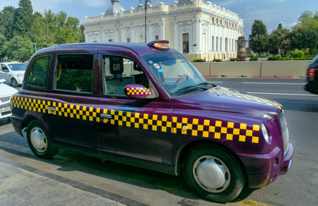 Baku, Azerbaijan - September 10, 2016: Baku city taxi on the street. The people called eggplant taxis due to its purple colorのeditorial素材