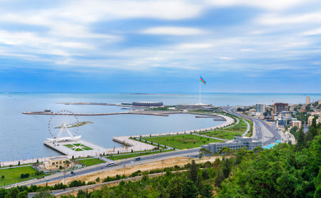 Baku, Azerbaijan - September 11, 2016: View of the city, Ferris wheel and National Flag Square in the evening. Baku is the largest city on the Caspian Sea and of the Caucasus regionのeditorial素材
