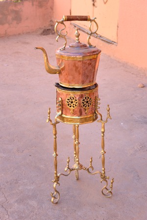 Traditional Copper kettle and burner on sale in the street. Moroccoの写真素材