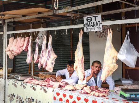 Sheki, Azerbaijan - September 13, 2016: Butcher shop at the Local town market. Sheki is small city situated in northern Azerbaijan in the southern part of the Greater Caucasus mountain range.のeditorial素材