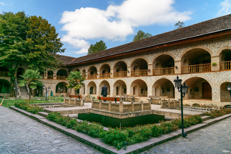 Sheki, Azerbaijan - September 13, 2016: View of the inner courtyard of Upper caravanserai is a historical monument in Sheki 18th-19th centuries. It was used by merchants to store their goods in cellars, who traded on the first floor, and lived on the secoのeditorial素材