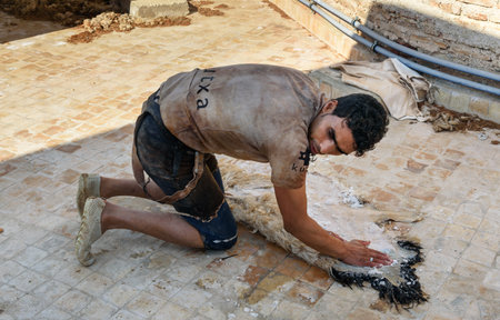 Fez, Morocco - Jan 14, 2017: Worker in the Leather traditional tannery in ancient medina of Fes El Baliのeditorial素材