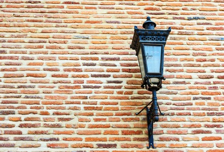 Street lantern on brick wall backgroundの写真素材