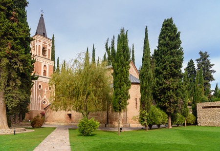 Bell tower and St. George's church in Monastery of St. Nino at Bodbe. Cathedral was constructed in...