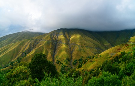 View in the Caucasus Mountains in the clouds. Dangerous road to Omalo in Tusheti region. Georgia