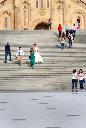 Tbilisi, Georgia - September 22, 2016: Holy Trinity Cathedral, Sameba Cathedral. People from wedding ceremony on the stairsのeditorial素材