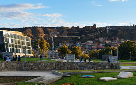 Tbilisi, Georgia - September 26, 2016: View on cableway under roof of houses Old city from Rike park...