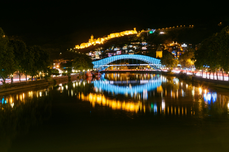 Bridge of Peace over the Kura River at night in Tibilisi, Georgiaの写真素材