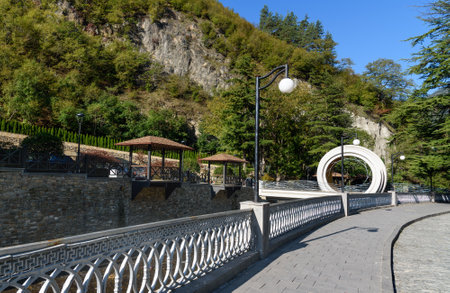 Borjomi, Georgia - October 02, 2016: View on embankment and Modern bridge over Borjomula riverのeditorial素材
