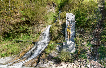 Borjomi, Georgia - October 01, 2016: Monument of Prometheus near waterfall in Mineral water parkのeditorial素材