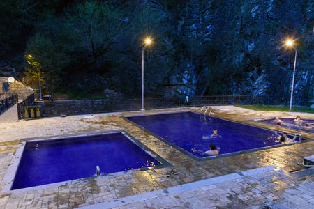 Borjomi, Georgia - October 01, 2016: Open air sulphur water swimming pools at Mineral water park in eveningのeditorial素材