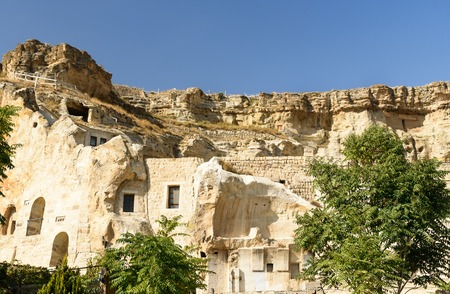 View of cave houses in mountains at Urgup. Cappadocia. Nevsehir Province. Turkeyの写真素材