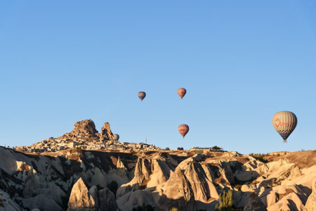 Goreme, Turkey - October 16, 2016: Top view of Uchisar town and castle from hot air balloon at sunrise. Cappadocia. Nevsehir Province. Turkeyのeditorial素材